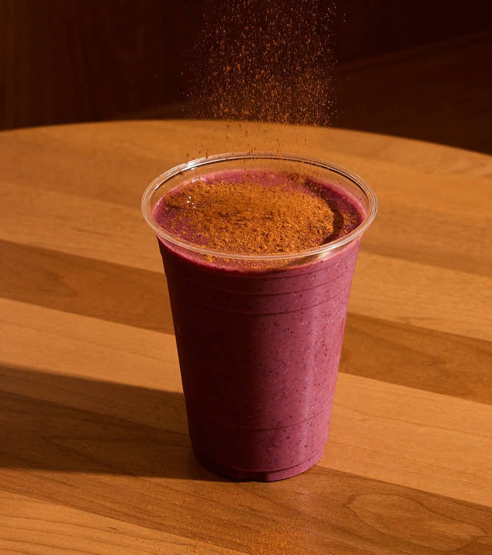 Açaí berry protein smoothie dusted with cinnamon