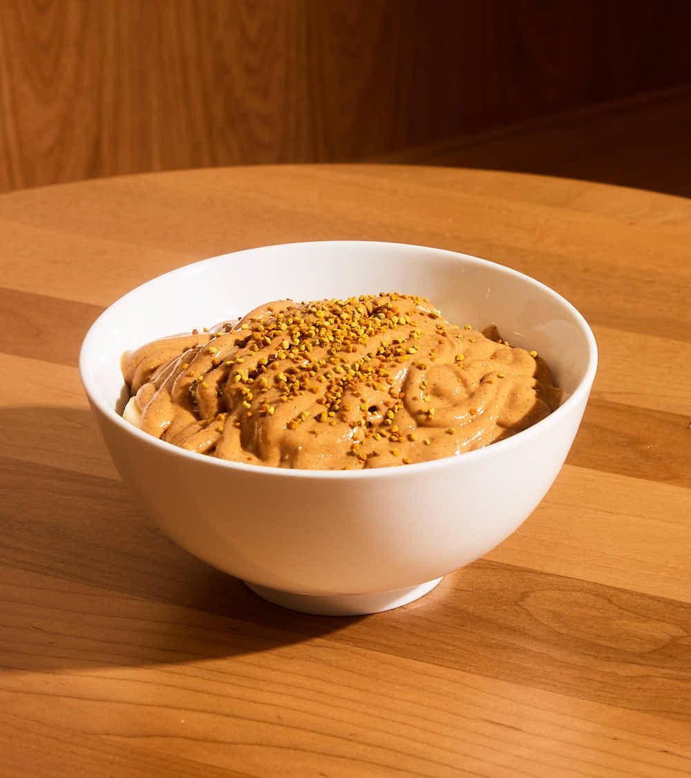 Nuts About Lulu açaí bowl covered in peanut butter and bee pollen