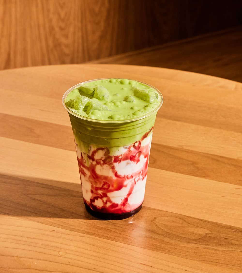 Iced matcha cloud layered over strawberry milk